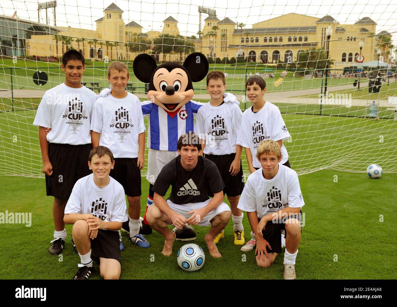 Argentina and FC Barcelona's soccer player Lionel Messi poses with Orlando-area youth soccer players and Mickey Mouse during his vacation at Disney's Wide World of Sports Complex in Kissimmee, Florida, USA on July 9, 2009. Photo by Kent Phillips/Cameleon/ABACAPRESS.COM Stock Photo