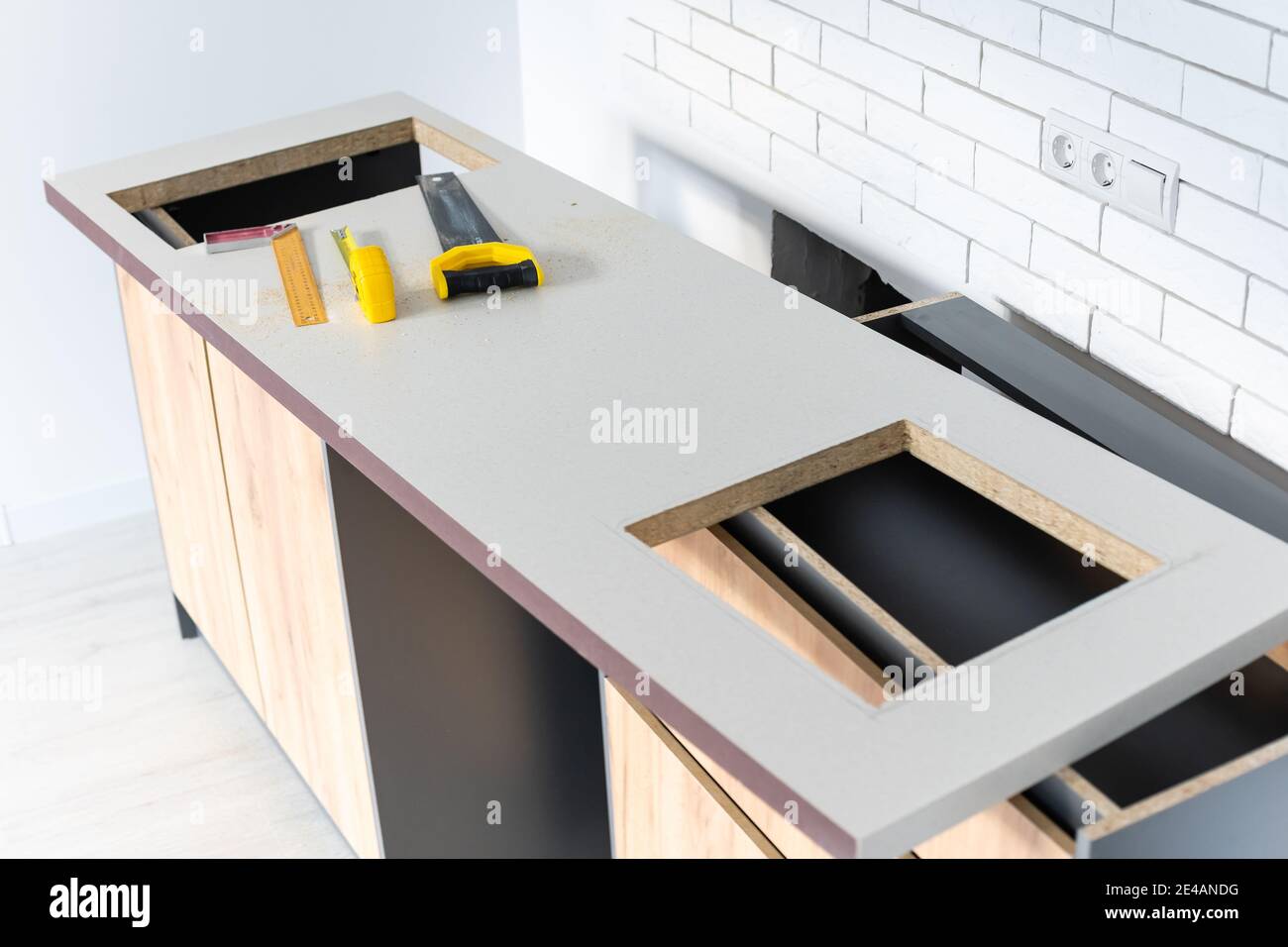 to cut holes in the kitchen countertop for equipment Stock Photo Alamy