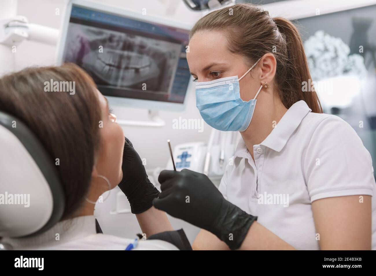Female dentist wearing face mask hires stock photography and images