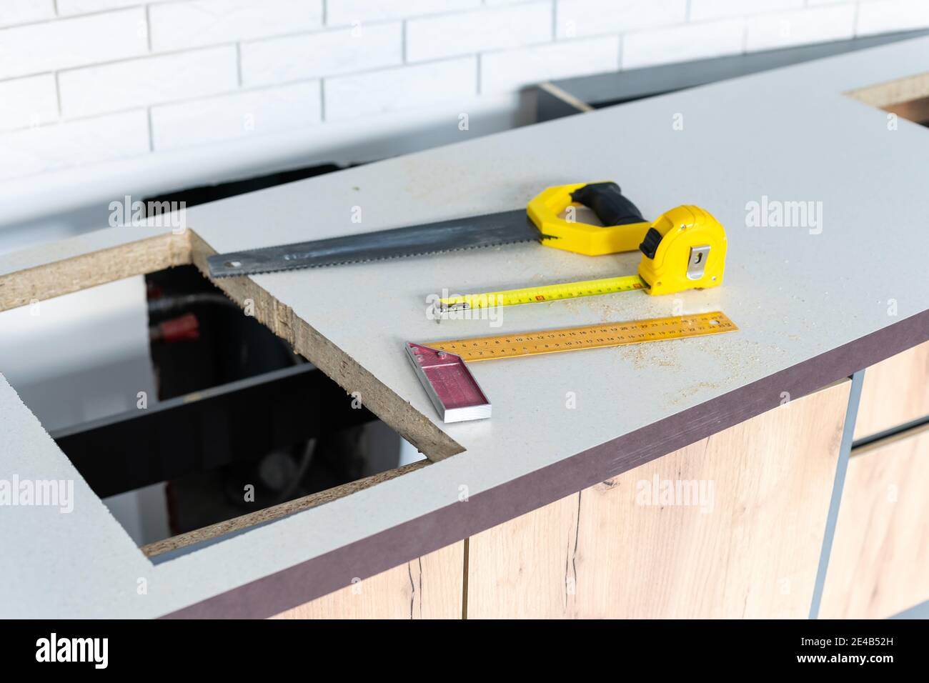 to cut holes in the kitchen countertop for equipment Stock Photo Alamy
