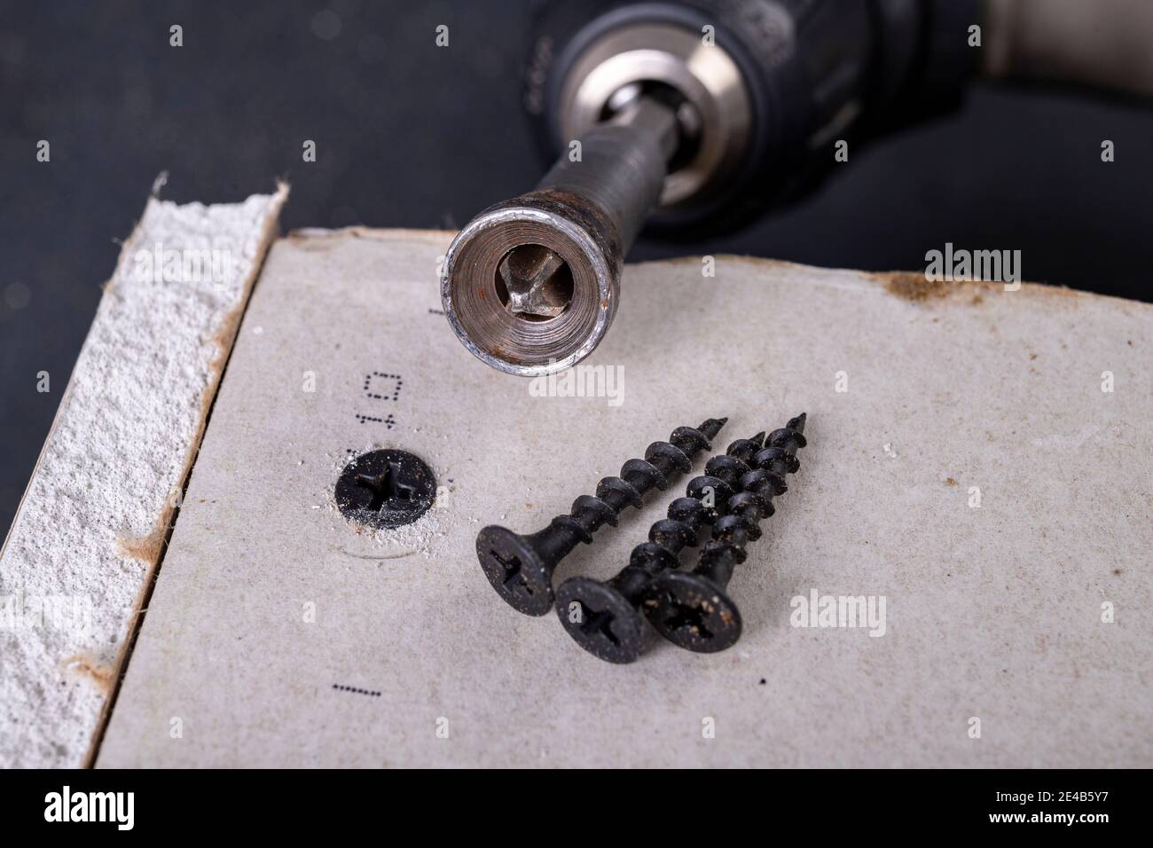 Black screws for fixing plasterboards. Building a wall of drywall