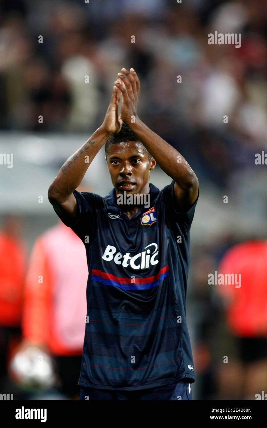 Lyon's Michel Bastos celebrates victory with supporters at the end  ofsecond-leg Champions League play-off soccer match between Olympique  Lyonnais of Lyon, (France) and Royal Sporting Club Anderlecht (Belgium), at  Constant Vanden Stock