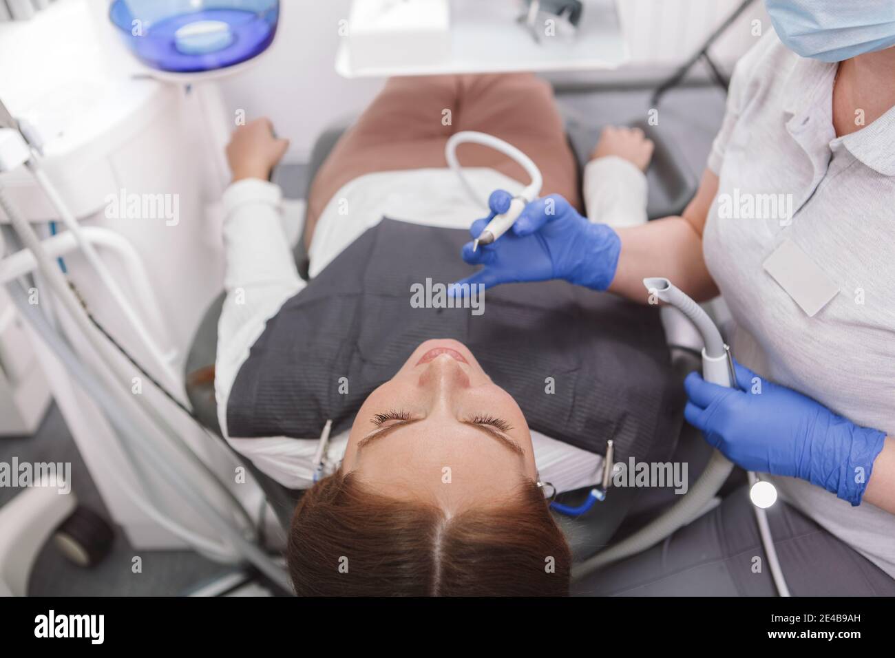 Top view cropped shot of female patient in dental chair during teeth examination Stock Photo