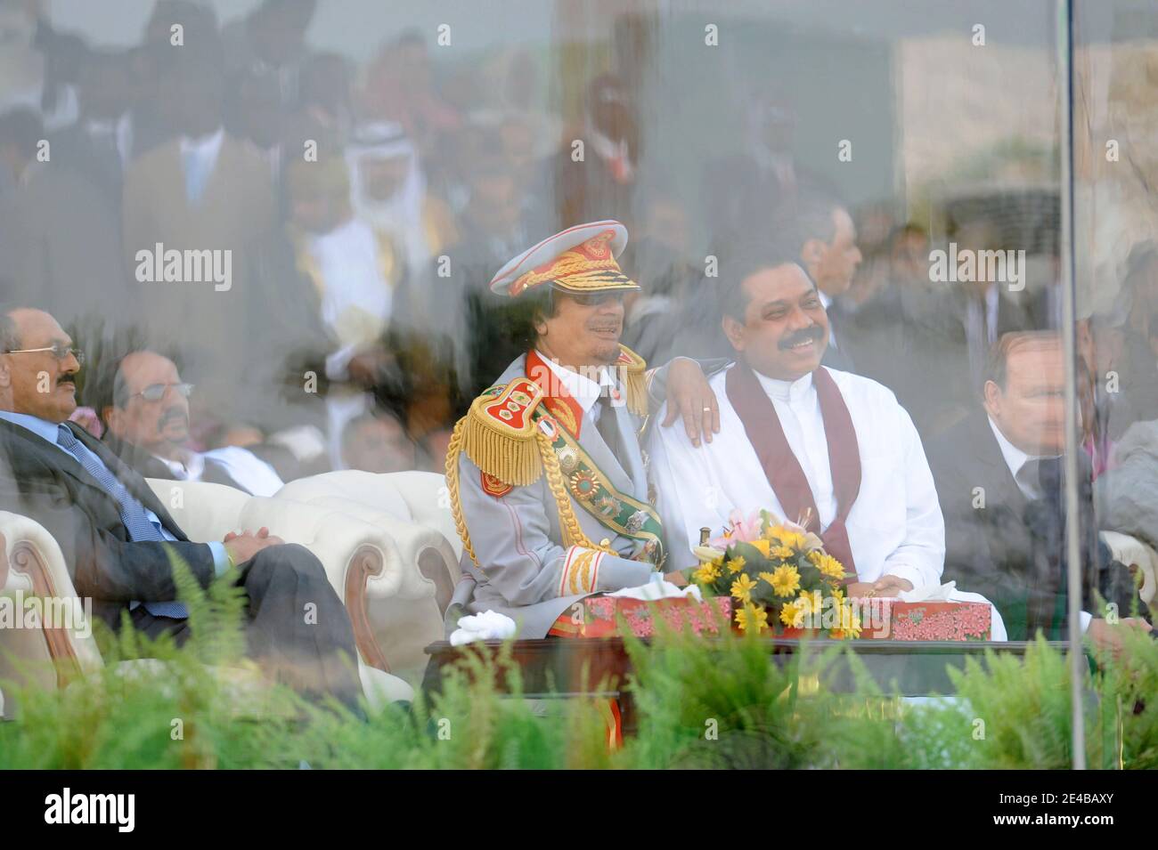 Libyan leader Muammar Gaddafi seen next to Sri Lanka's president Mahinda Rajapaksa during military parade organised in Tripoli, Libya, on September 1st, 2009, as part of many festivities to celebrate 40th anniversary of 'Al Fateh' revolution, lead by Muammar Gaddafi, on September 1st, 1969. The parade included bands from many countries, including French Legion Etrangere and was attended by many heads of state. Photo by Ammar Abd Rabbo/ABACAPRESS.COM Stock Photo