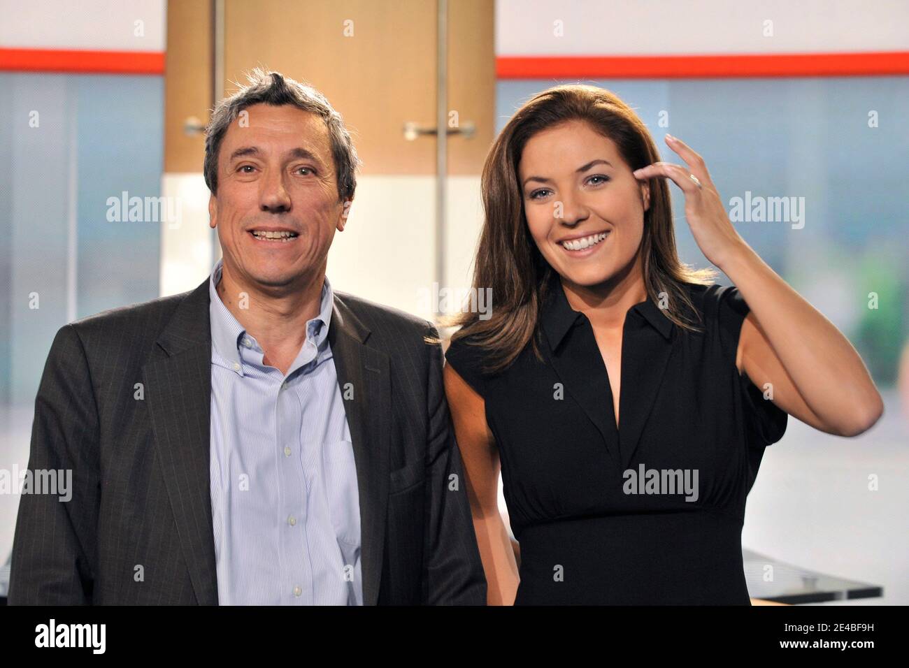 NO TABLOIDS. TV Anchor and journalist Claire Barsacq (R) and news director  Jerome Bureau from M6 pose after the evening news program, in Neuilly sur  Seine, France, on September 7, 2009. Photo