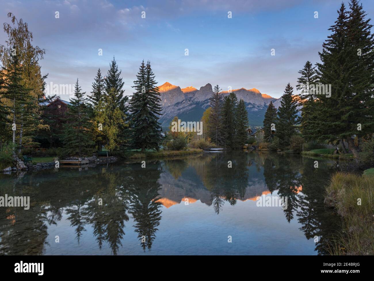 View of the Spring Creek Pond at sunset, Mount Rundle, Canmore, Alberta, Canada Stock Photo