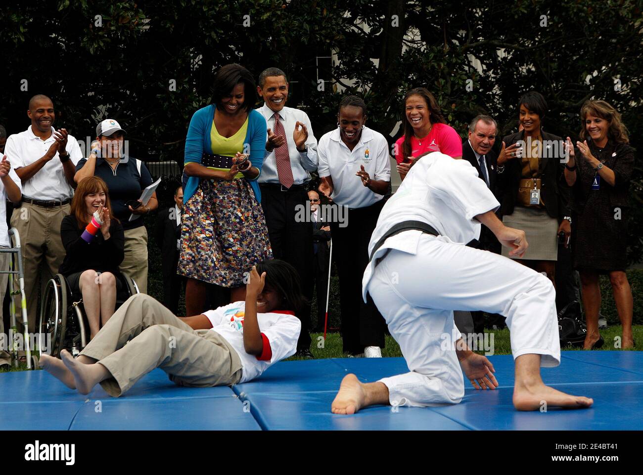 President Barack Obama and his wife Michelle watch a demonstration of judo during an event on Olympics, Paralympics and Youth Sport Canadian on the South Lawn of the White House, Washington, DC,