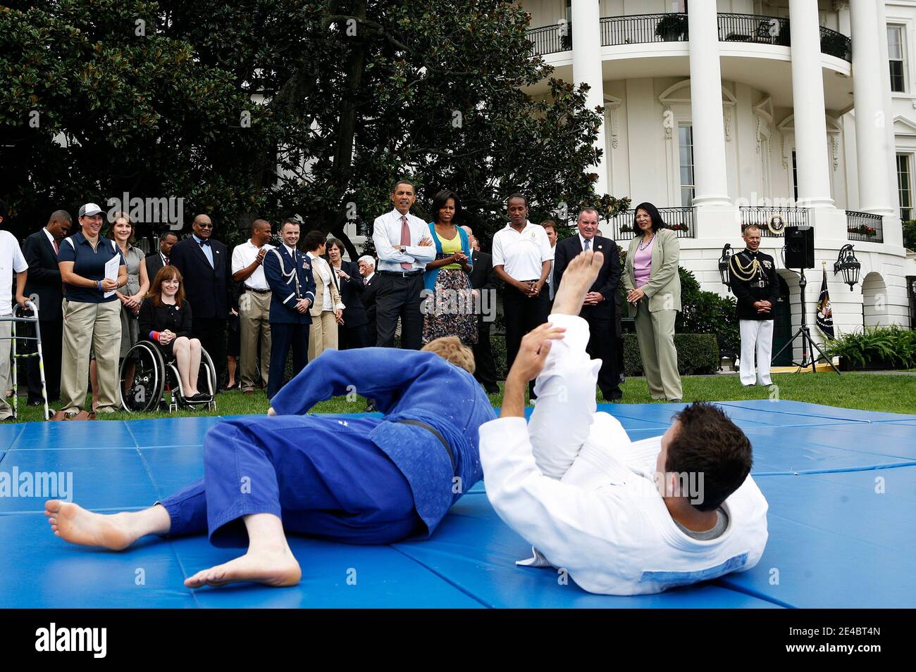 President Barack Obama and his wife Michelle watch a demonstration of judo during an event on Olympics, Paralympics and Youth Sport Canadian on the South Lawn of the White House, Washington, DC,