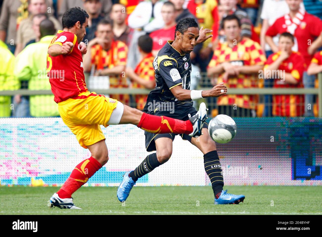 Lens' Fabien Laurenti fights for the ball with Lille's Pierre-Emerick Aubameyang during the French First League Soccer Match, RC Lens vs Lille OSC at Felix Bollaert Stadium in Lens, France on September 20, 2009. The match ended in a 1-1 draw. Photo by Mik Stock Photo