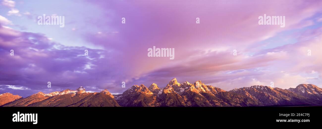 Mountain range at sunrise, Teton Range, Grand Teton National Park, Wyoming, USA Stock Photo
