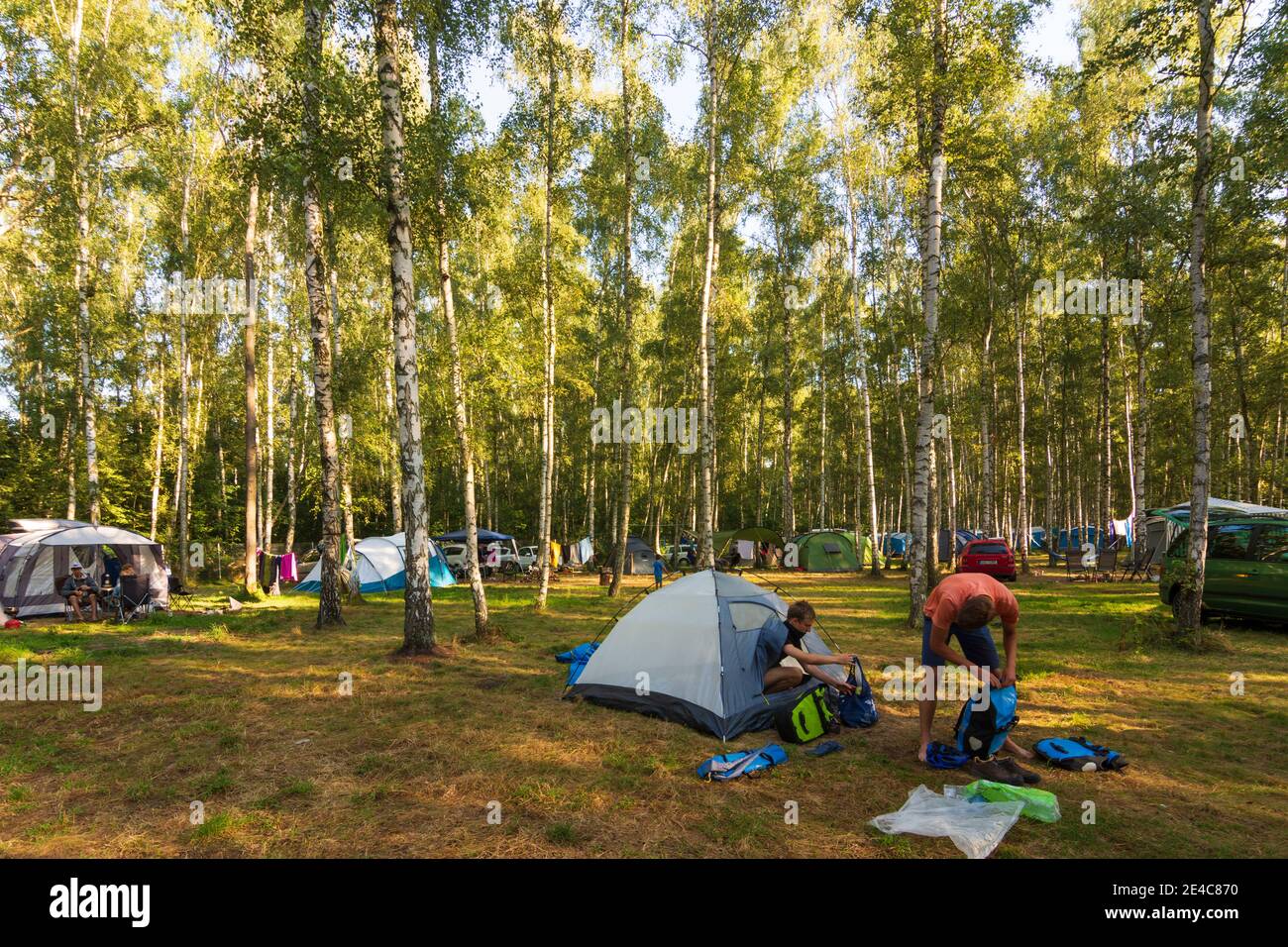 Hradek nad Nisou (Grottau), camping site at lake Kristyna, tourists packing up in Liberecky, Liberec Region, Reichenberger Region, Czech Stock Photo