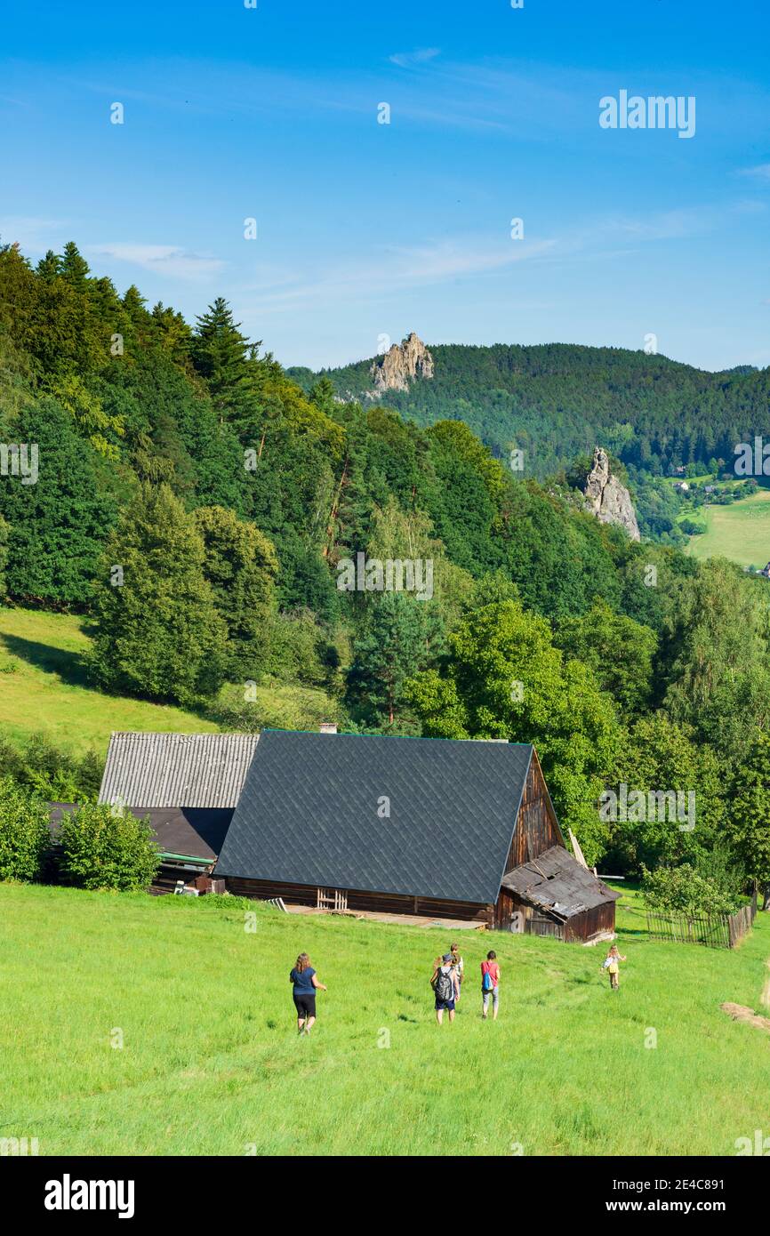 Mala Skala (Kleinskal), rocks, wooden farmhouse, hiker in Liberecky, Liberec Region, Reichenberger Region, Czech Stock Photo