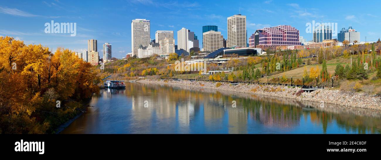 Reflection of skylines in a river, North Saskatchewan River, Edmonton, Alberta, Canada Stock Photo