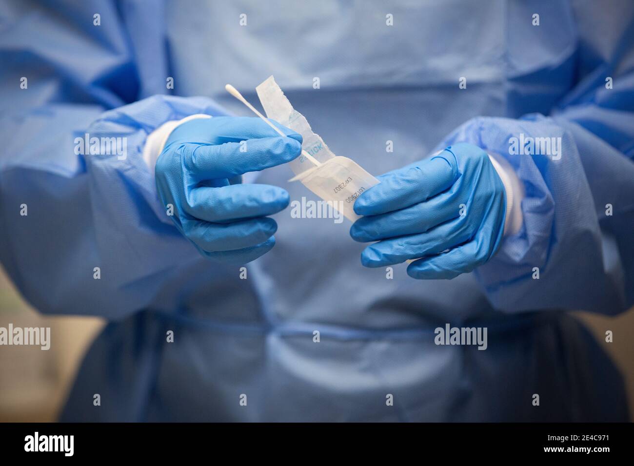 A pharmacist holds a COVID-19 test swab at a pharmacy in Amherstview, Ontario on Friday, January 22, 2021, as the COVID-19 pandemic continues across C Stock Photo