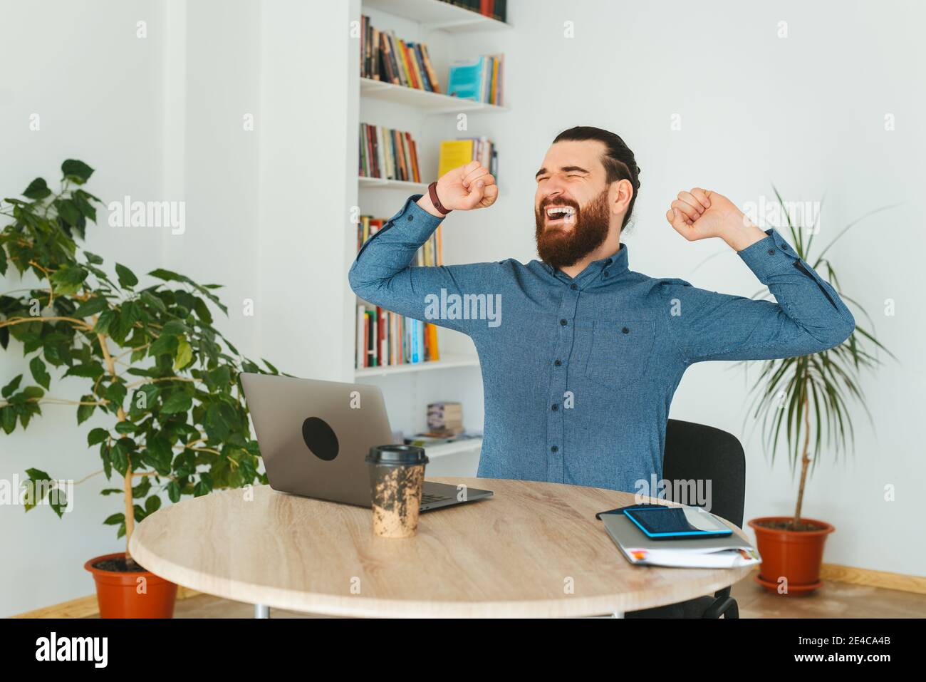 Photo of man in casual working in office and yelling. Stock Photo