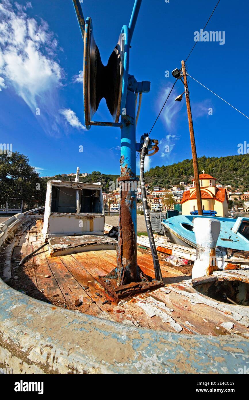 The abandoned fishing boats are rotting in the old fishing port of Gythion, Mani Peninsula, Peloponnese, Greece Stock Photo