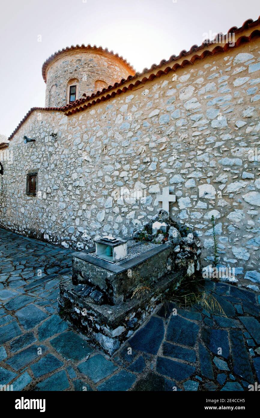 Historic burial site on the outer wall of the church in the hamlet of Ageranos in the northeast of the Mani Peninsula, Peloponnese, Greece Stock Photo