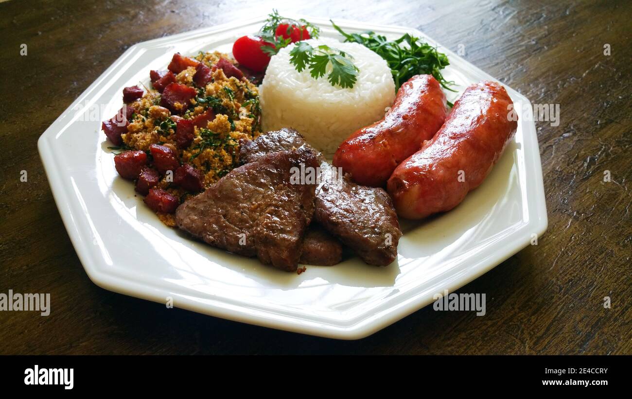 Brazilian Barbecue food dish on aged background. Stock Photo