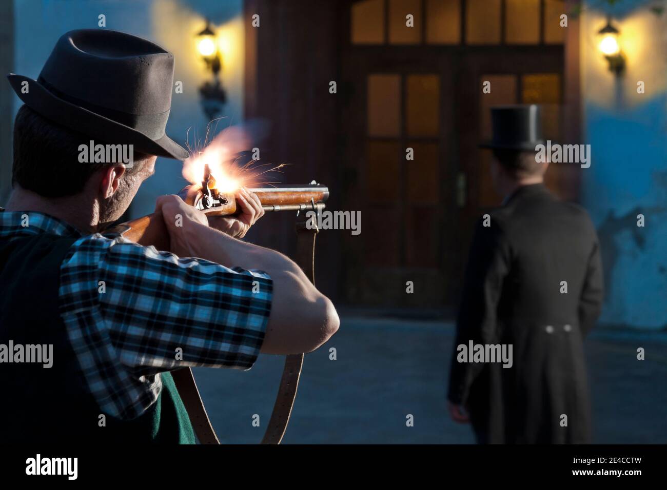 Man shoots from ambush with rifle at passing person Stock Photo