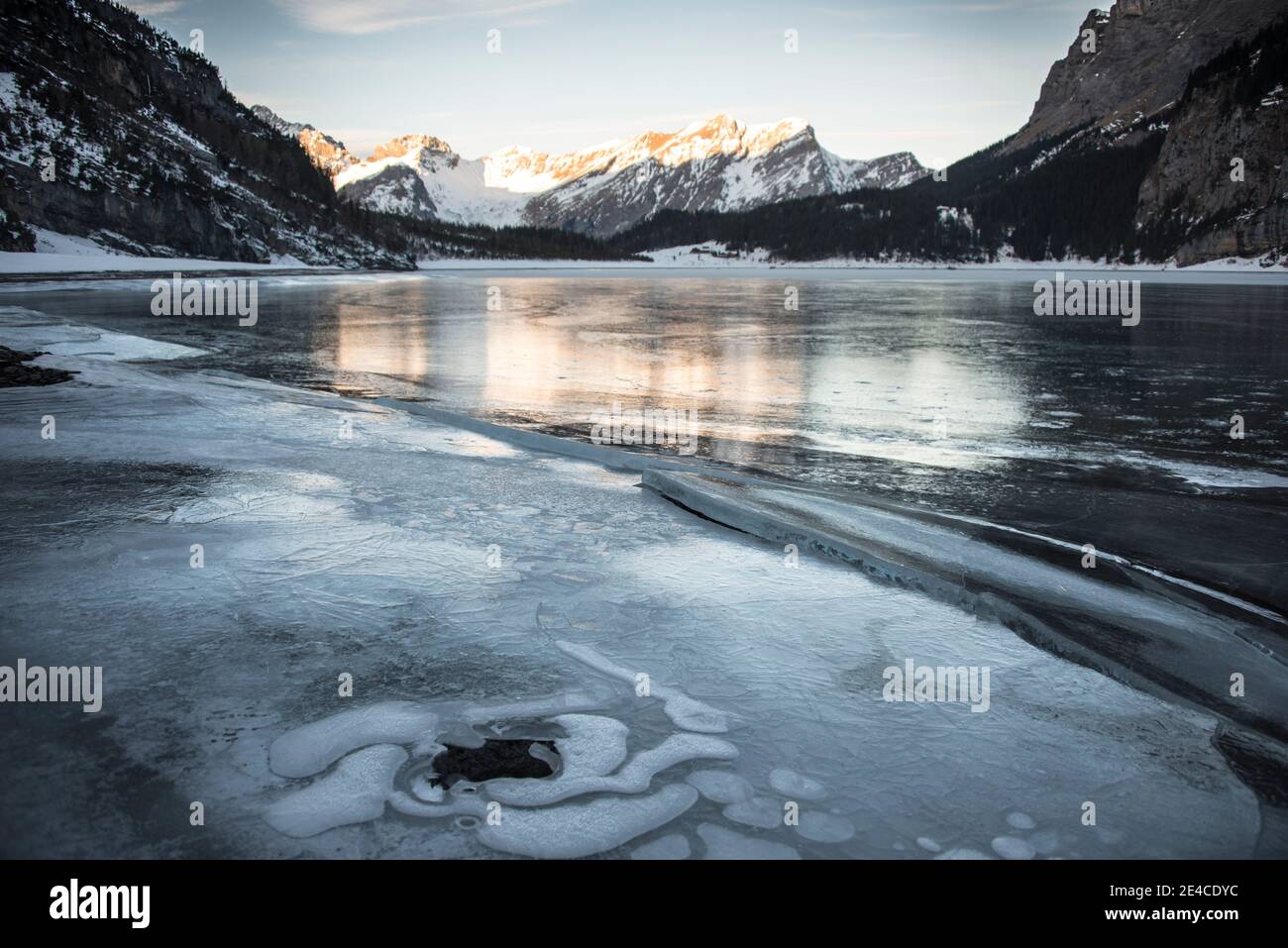 frozen mountain lake at daybreak Stock Photo
