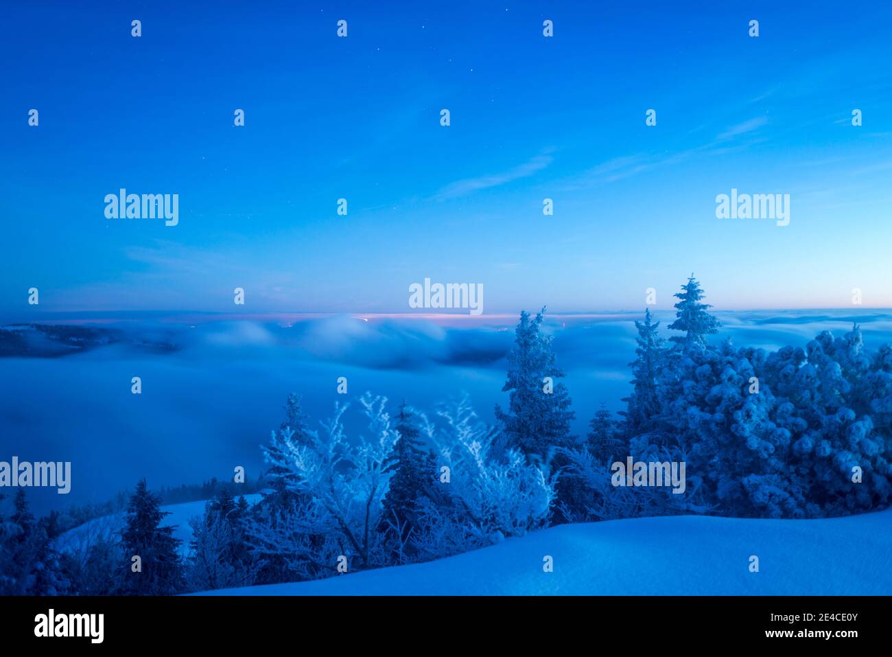 blue hour on freshly snow-covered mountain peak Stock Photo
