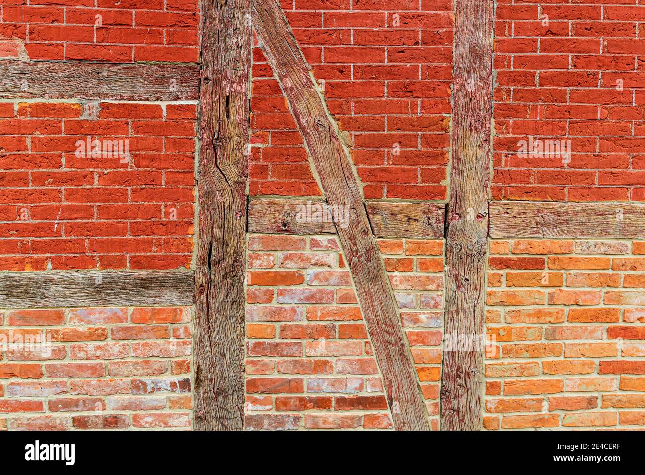 A red brick wall in a cross bracing executed as a halftimbered