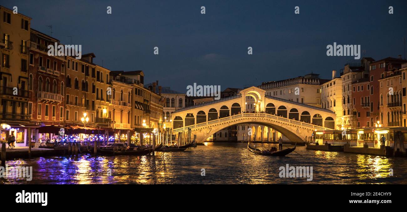 Venice during Corona times without tourists, illuminated Rialto Bridge Stock Photo
