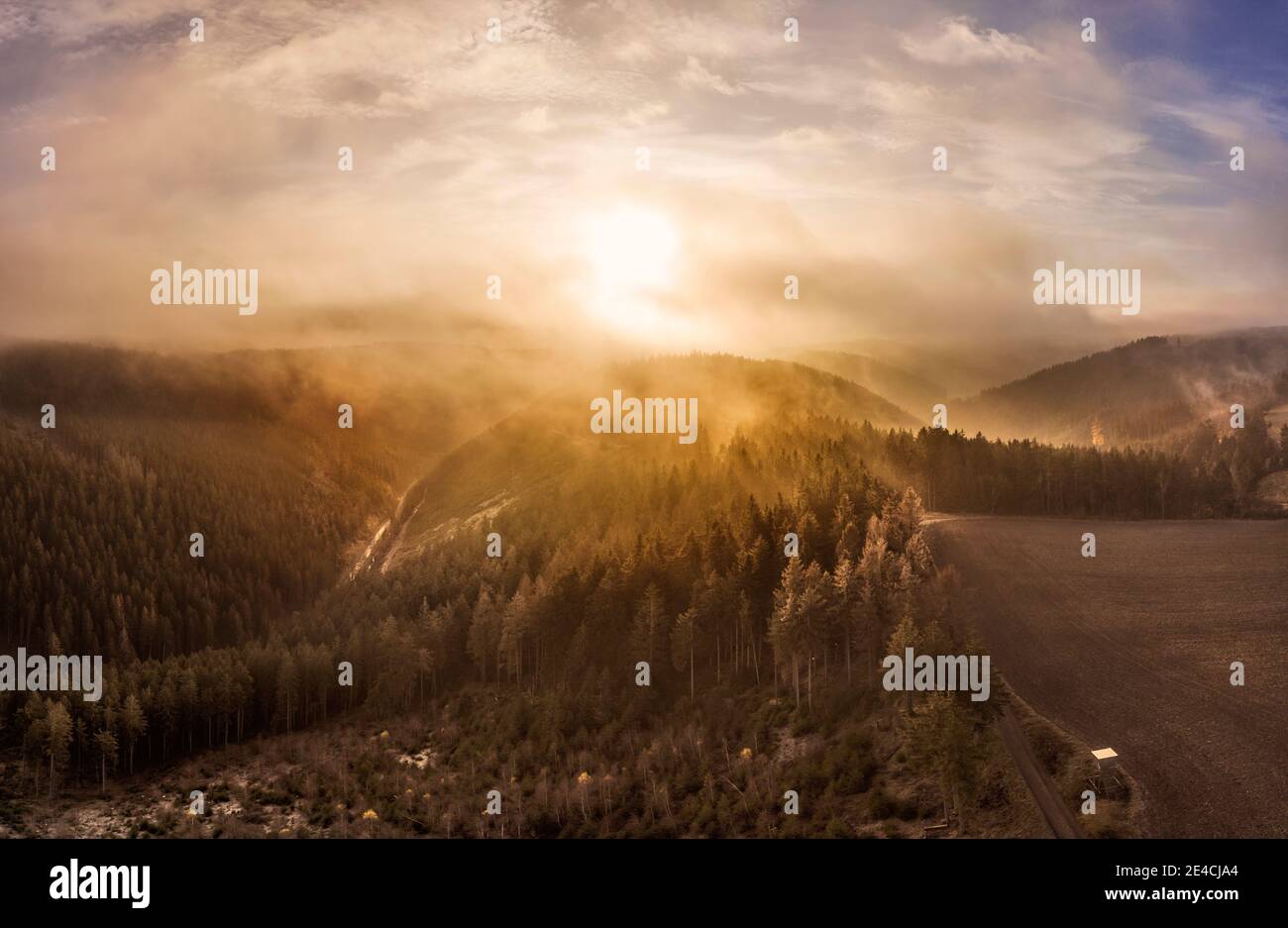 Germany, Thuringia, Großbreitenbach, Allersdorf, valleys, forest, mountains, road, sunrise, back light, aerial view Stock Photo