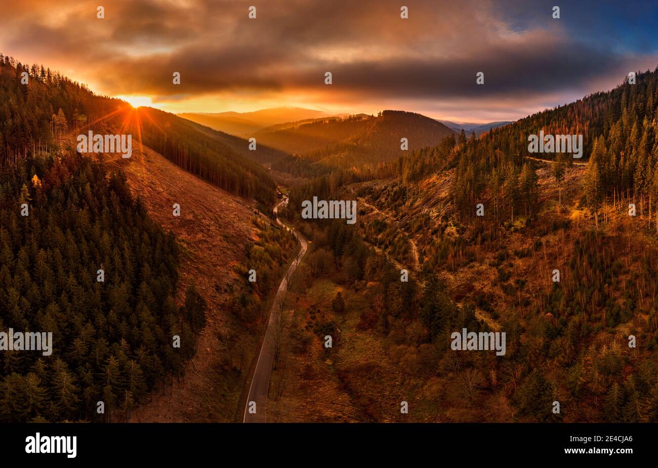 Germany, Thuringia, Großbreitenbach, Allersdorf, valley, forest, mountains, road, sunrise, back light, aerial view Stock Photo