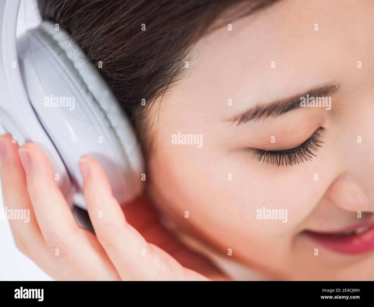 Young women listening music with earphone Stock Photo