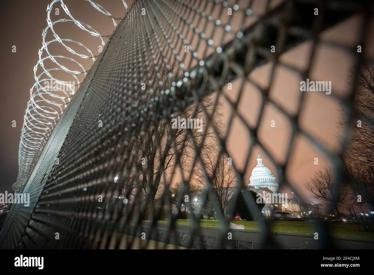 Washington, District of Columbia, U.S.A. 22nd Jan, 2021. Pre-Inaugural security preparations take shape on Capitol Hill and around the U.S. Capitol Building following the January 6th insurrection by President Donald Trump's supporters due to his assertions that the election had been stolen from him. Fencing topped with razor wire surrounds the grounds with streets deserted due to the ongoing lockdown in preparation for President-Elect Joe Biden's Inauguration. Credit: Mark Finkenstaedt/ZUMA Wire/Alamy Live News Stock Photo