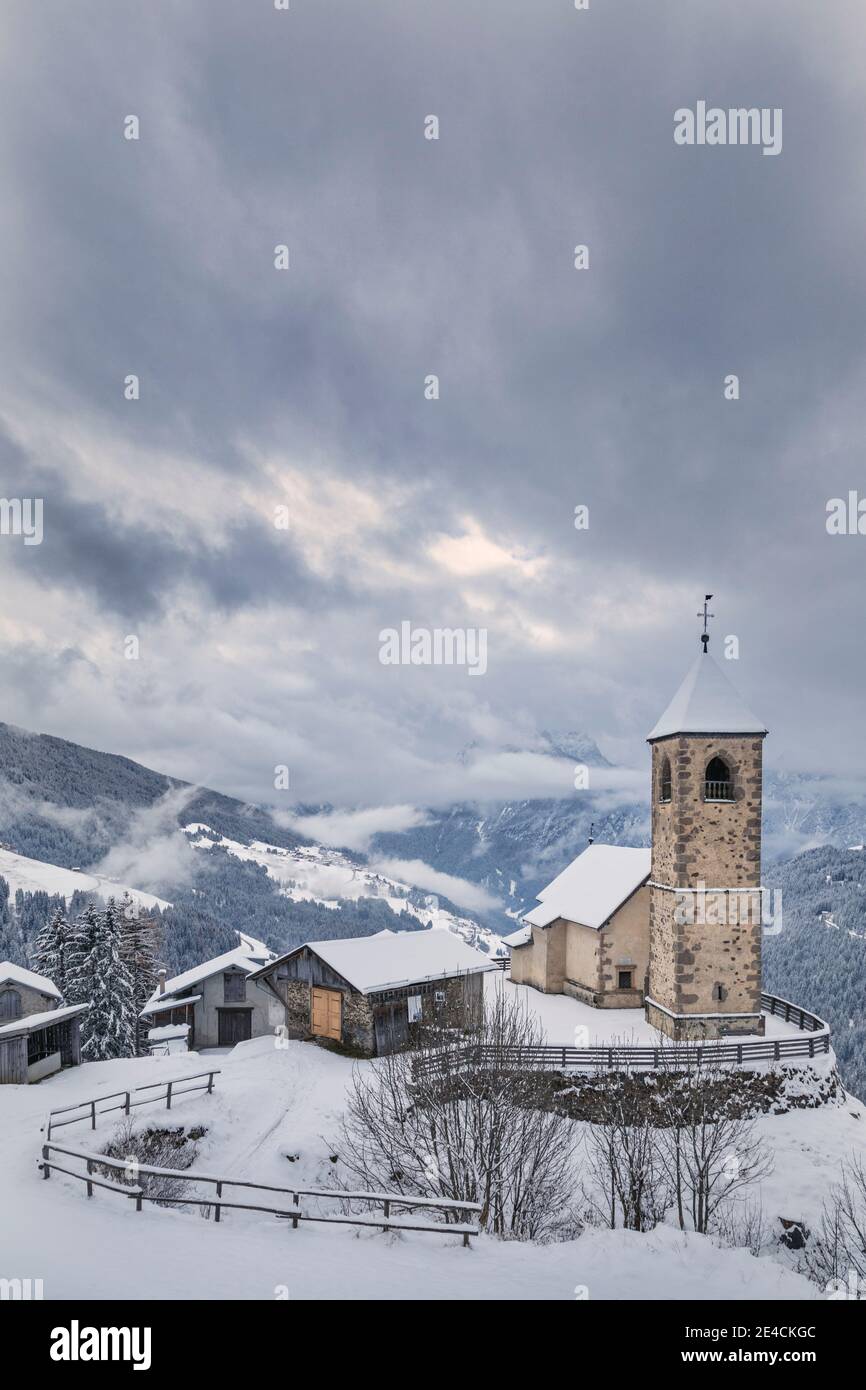 Italy, Veneto, province of Belluno, Comelico Superiore, Casamazzagno, the late gothic church of San Leonardo in winter Stock Photo