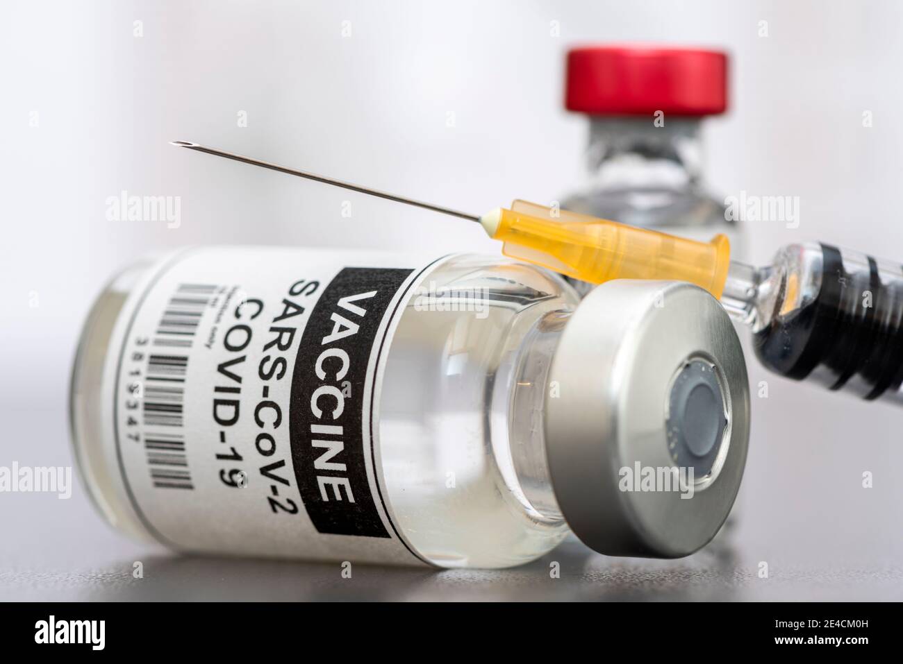 Vaccination against coronavirus with syringe and ampoule Stock Photo