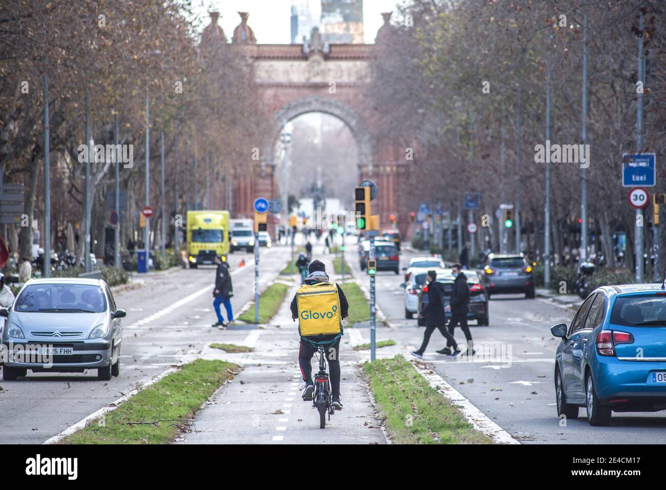 Barcelona, Spain. 22nd Jan, 2021. Glovo app delivery man seen riding a bike. The Ministry of Labor of Spain is developing a legislative framework that encompasses the activity of home delivery people known as riders, who operate for digital platforms such as Glovo, Deliveroo, Just Eat or Uber Eats. The new Rider Law would oblige companies to hire their workers and thus end the figure of the false self-employed. Credit: SOPA Images Limited/Alamy Live News Stock Photo