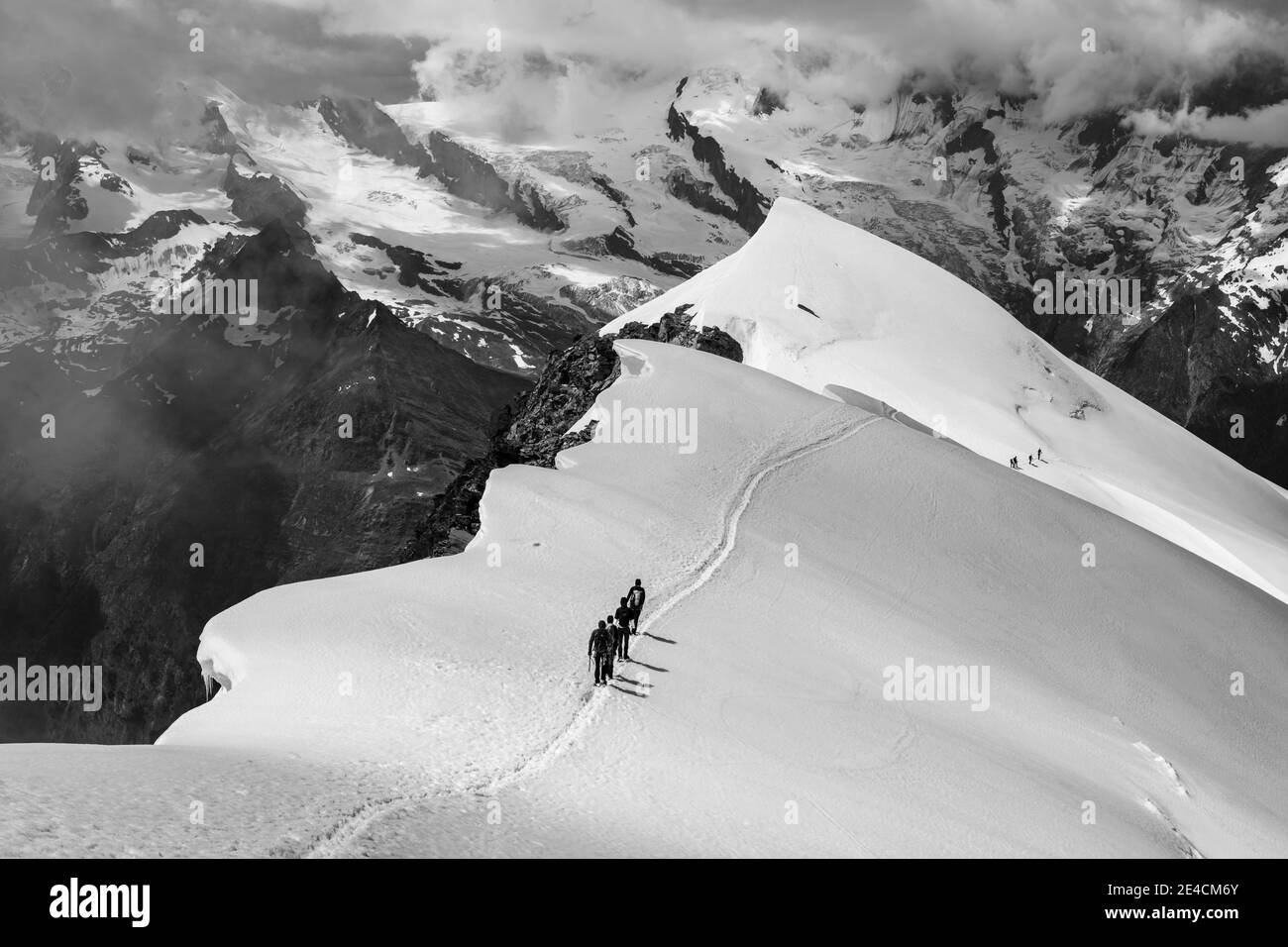 Switzerland, Canton of Valais, Saas Valley, Saas-Grund, mountaineers descending Weissmies west ridge Stock Photo