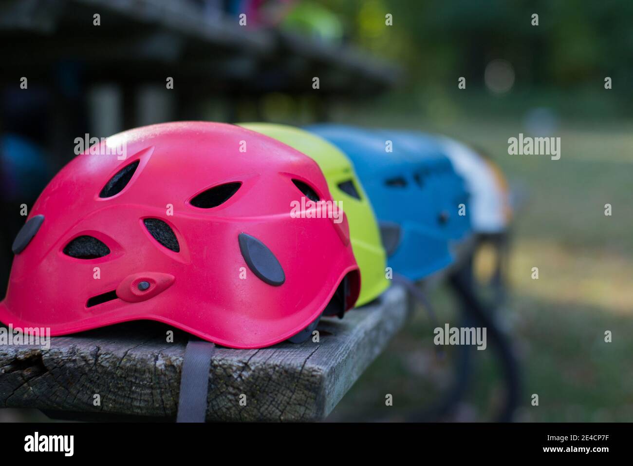 Multiple Rock Climbing Helmets with Foreground in Focus showing Team Work and Adventure Stock Photo