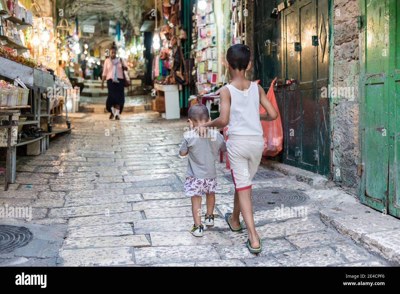 Israel, Jerusalem, Old City, two children run through bazaar Stock Photo