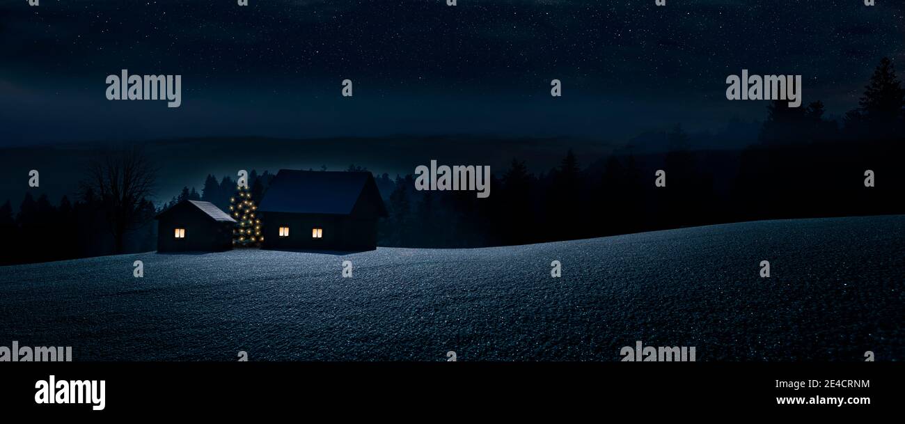 Small mountain village with Christmas tree in winter at night Stock Photo