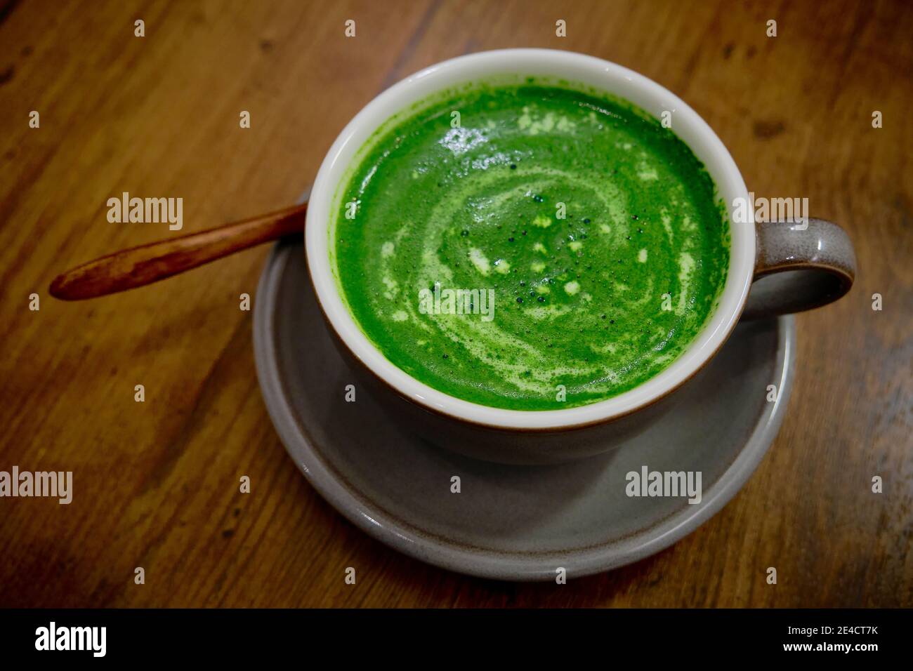 A cup of green Japanese macha latte in a cafe in Tokyo, Japan. Stock Photo