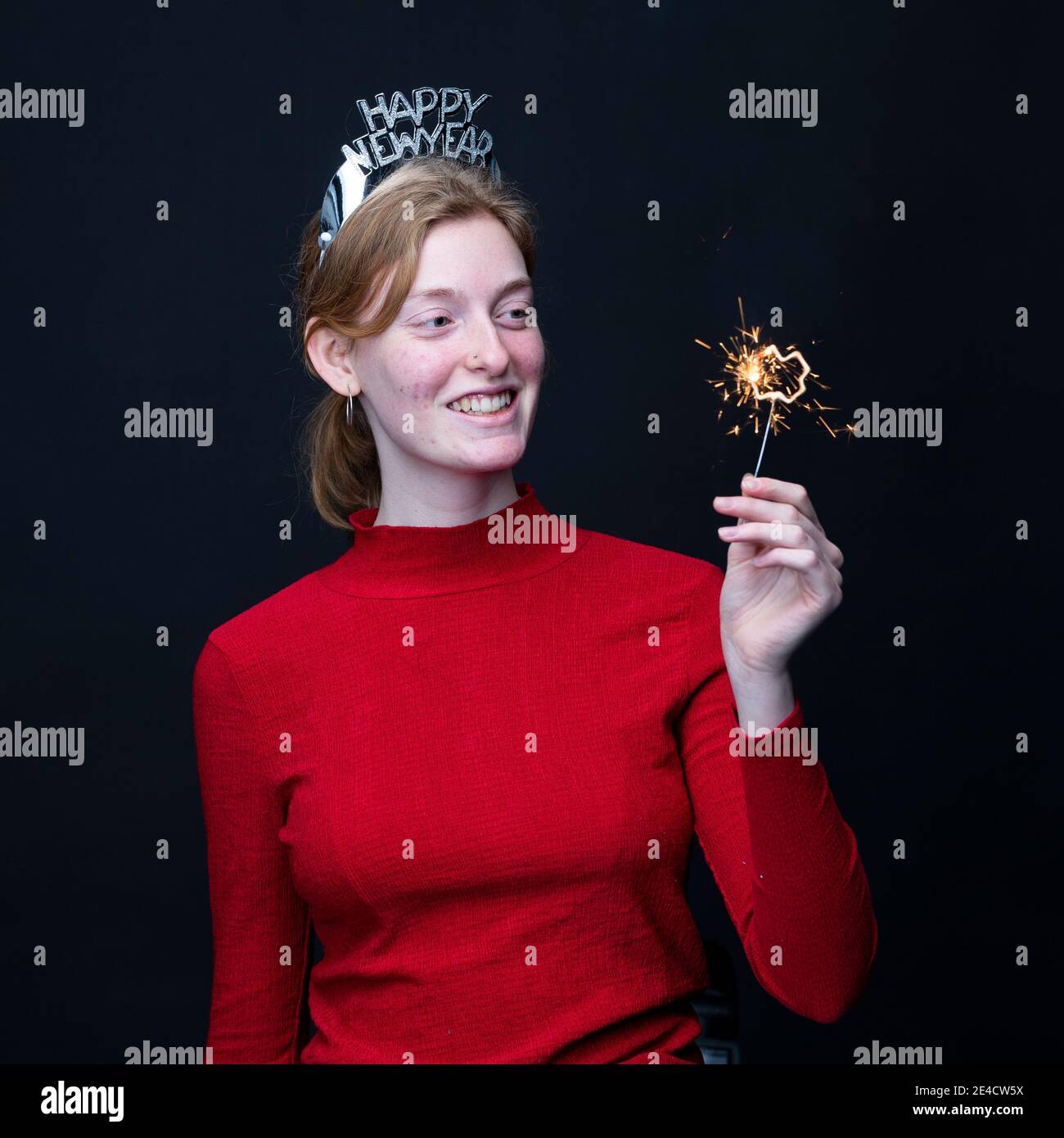 Woman celebrating New Years Eve Stock Photo