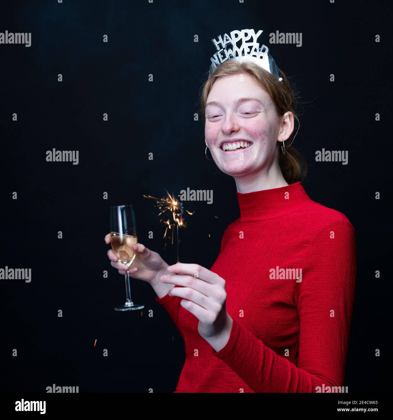 Woman celebrating New Years Eve Stock Photo