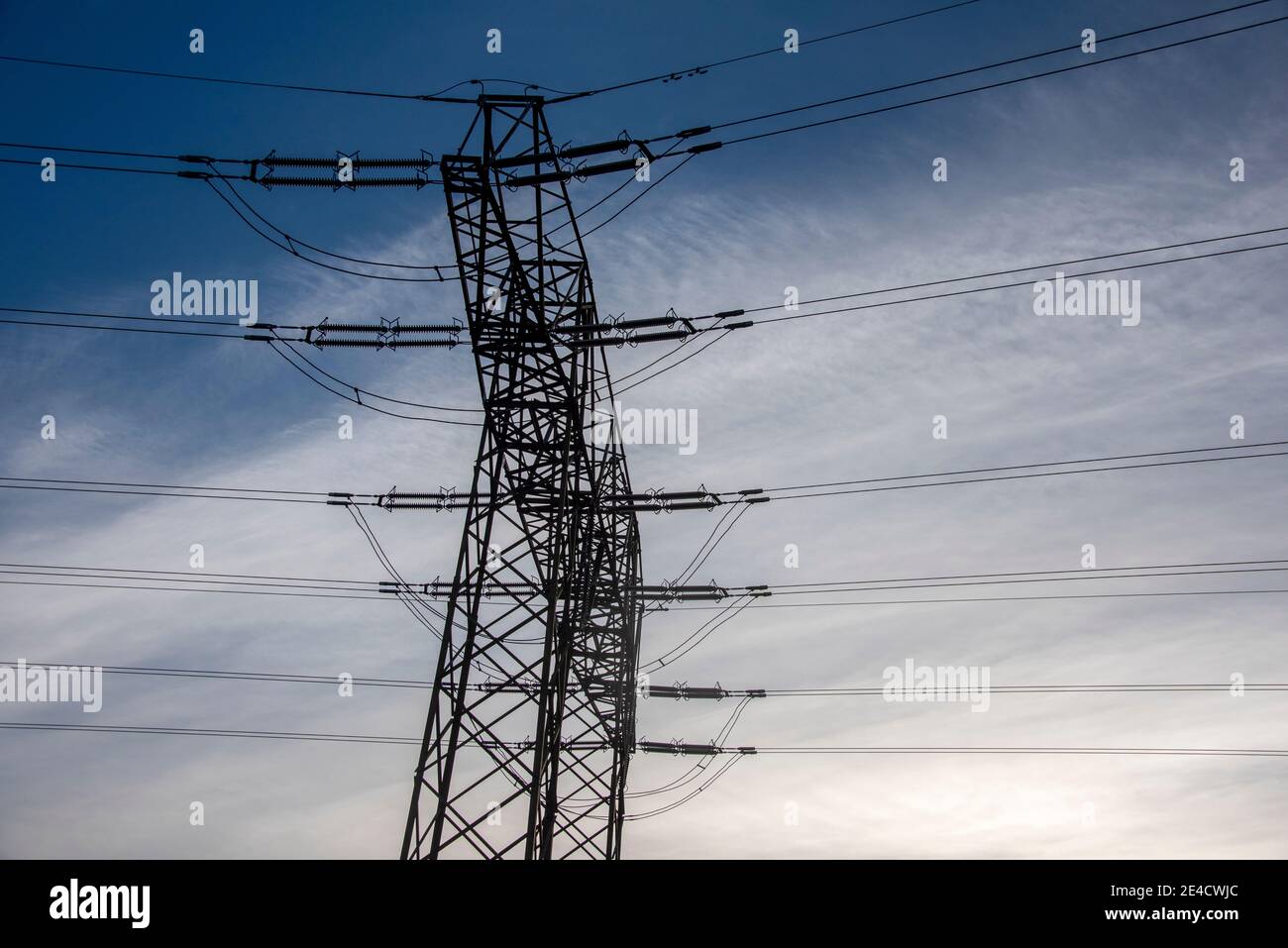 A power pole stands on a hill Stock Photo