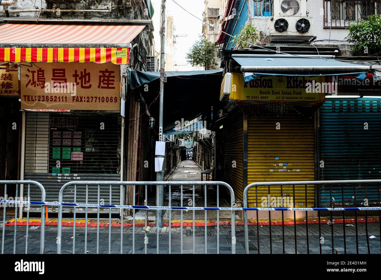Hong Kong, China. 23rd Jan, 2021. Empty street and closed shops are seen within the lockdown area in Jordon district. Hong Kong government locked down tens of thousand of residents to contain a worsening outbreak of the coronavirus. Credit: Keith Tsuji/ZUMA Wire/Alamy Live News Stock Photo