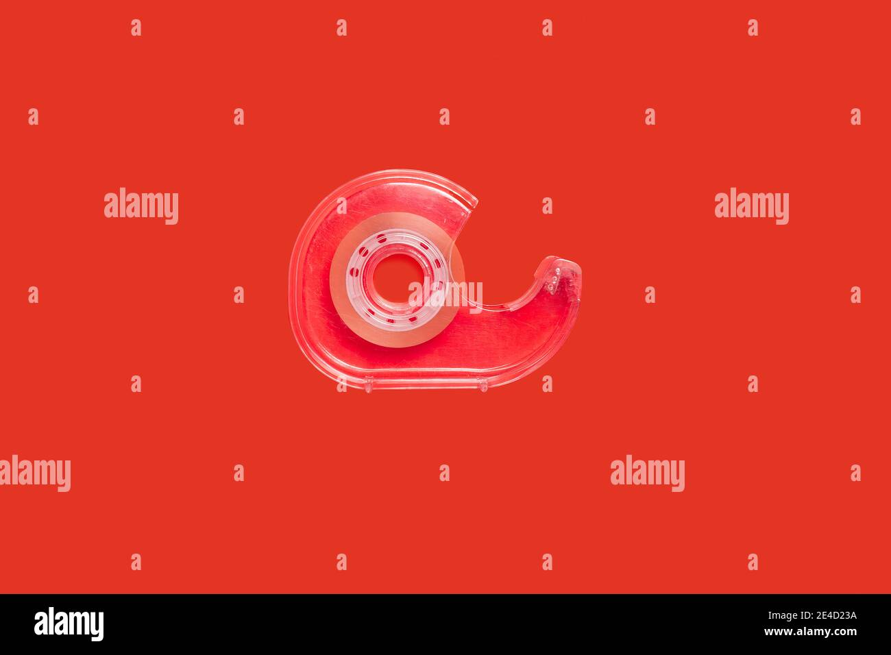 pink scotch tape dispenser isolated on red background Stock Photo Alamy