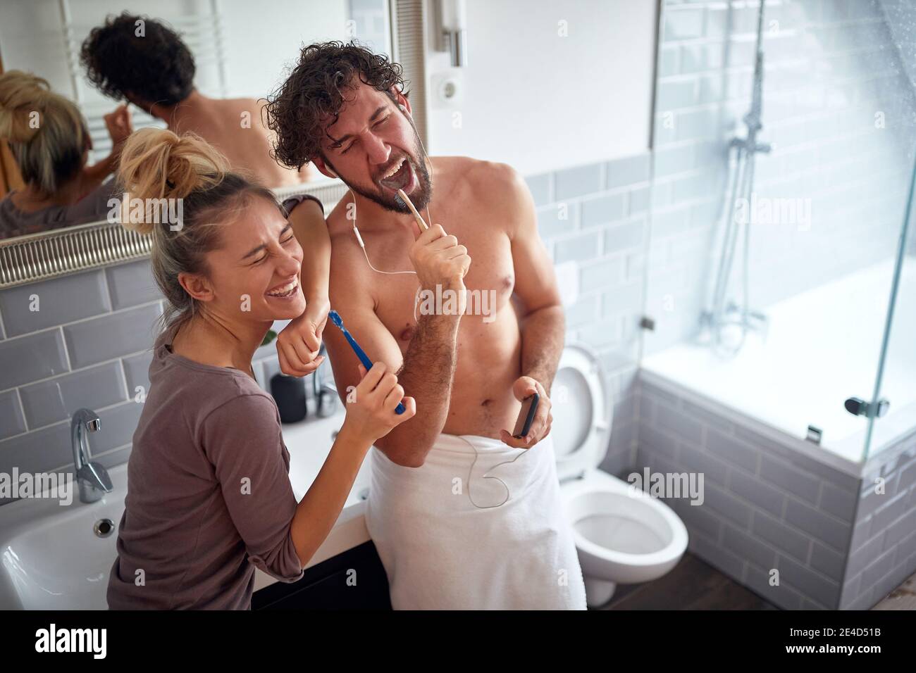 In love couple brushing teeth together in the morning Stock Photo