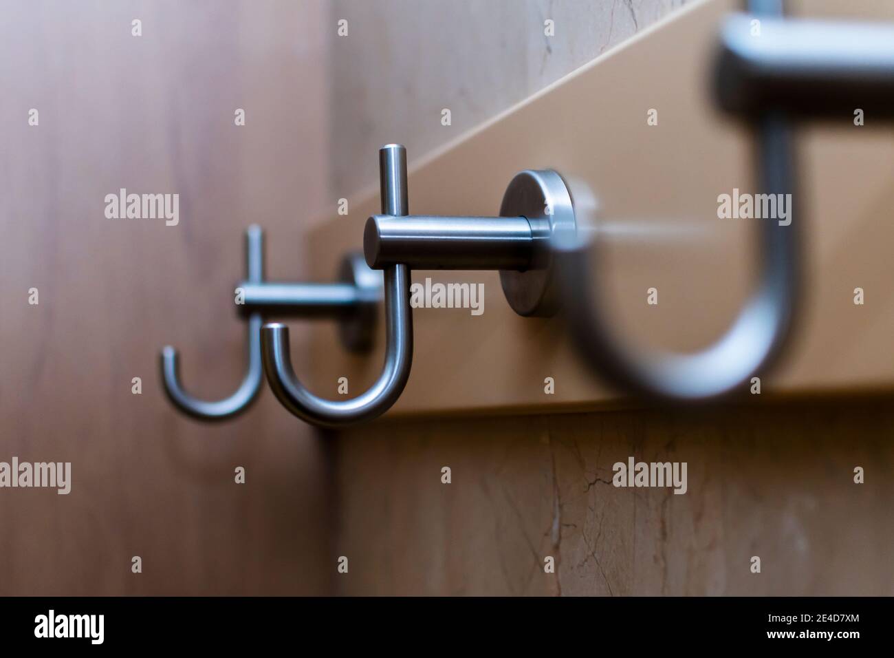 Empty coat hooks of a wardrobe Stock Photo