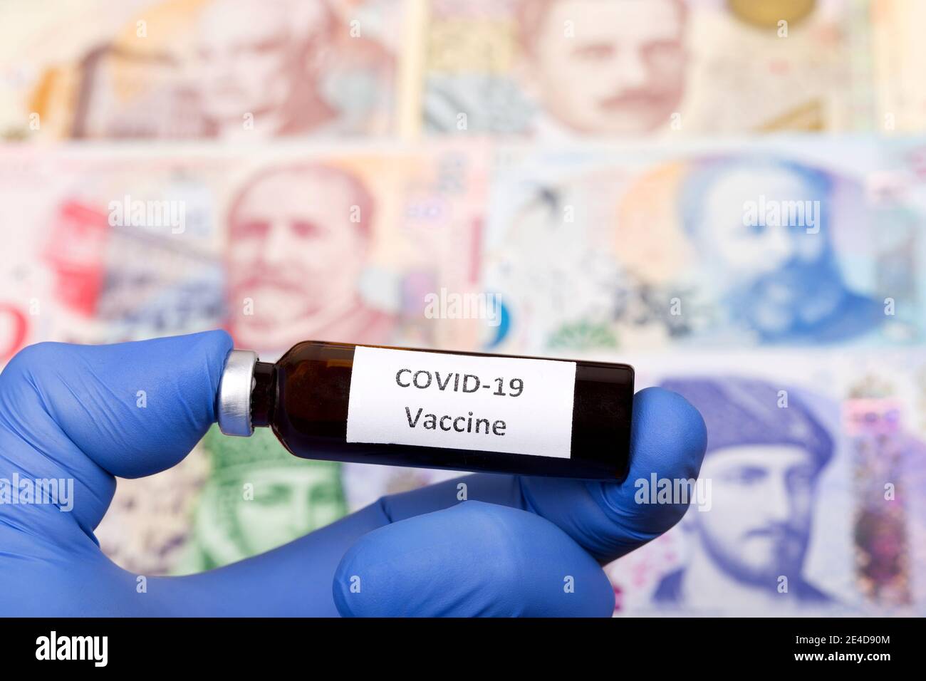 Vaccine against Covid-19 on the background of Georgian money Stock Photo