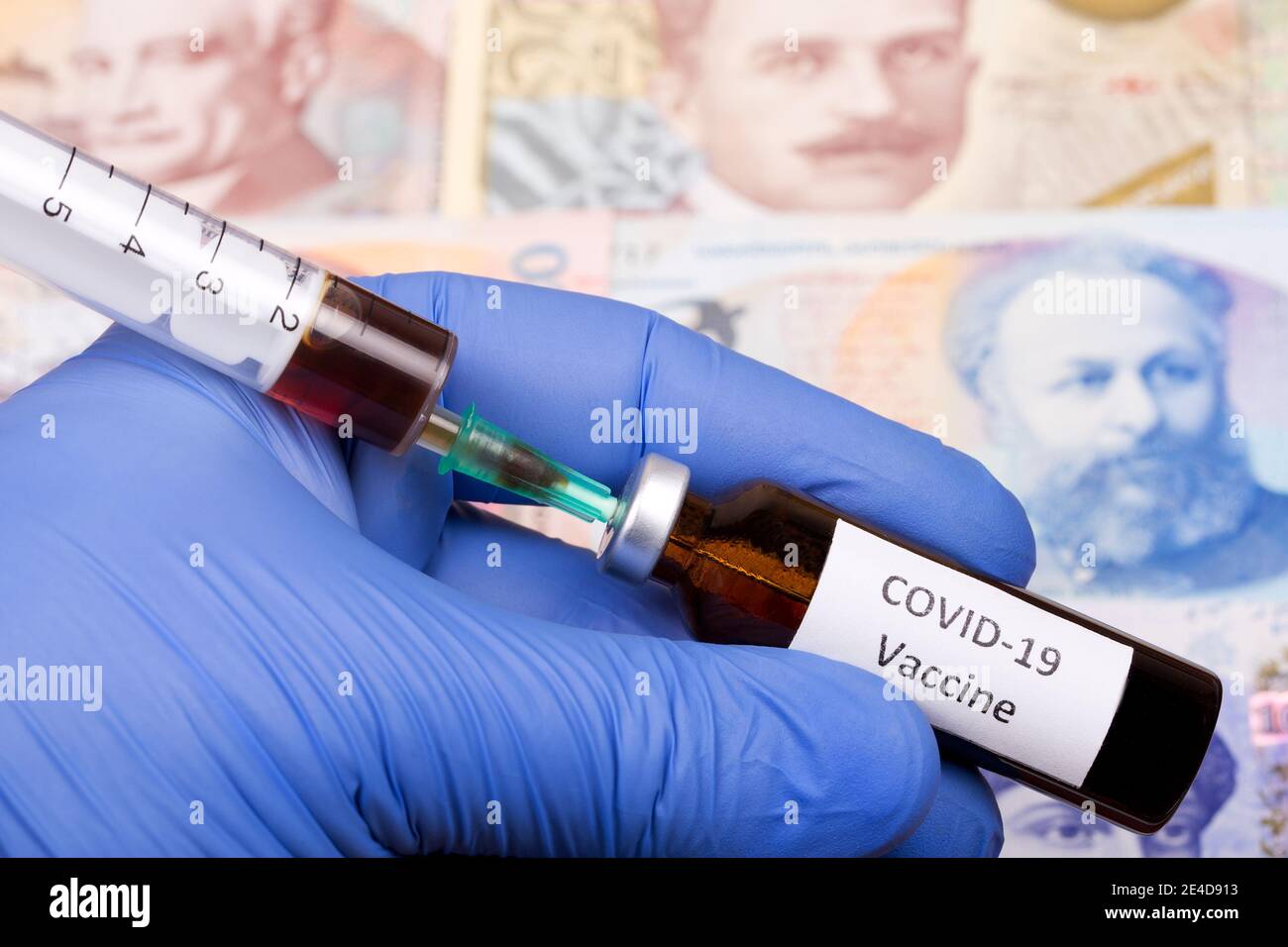 Vaccine against Covid-19 on the background of Georgian money Stock Photo