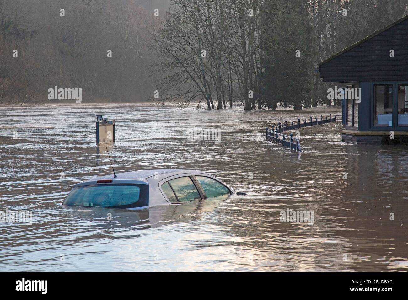 Shropshire, UK. 23rd Jan, 2021. Levels of the River Severn in Shropshire continued to rise overnight, causing sever floods in certain areas. The village of Jackfield in the Ironbridge Gorge World Heritage Site has been particularly badly hit, with homes and businesses badly flooded. Levels are very close to the records floods of February 2020. A car, left overnight in a riverside car park, is almost totally sumberged by the flood waters. Credit: Rob Carter/Alamy Live News Stock Photo