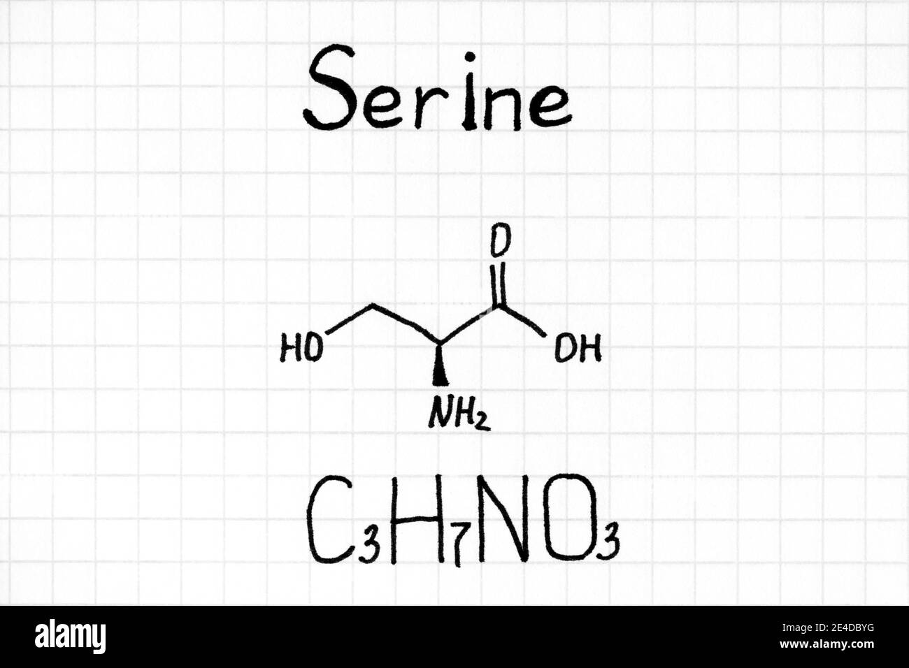 Handwriting Chemical formula of Serine. Close-up. Stock Photo